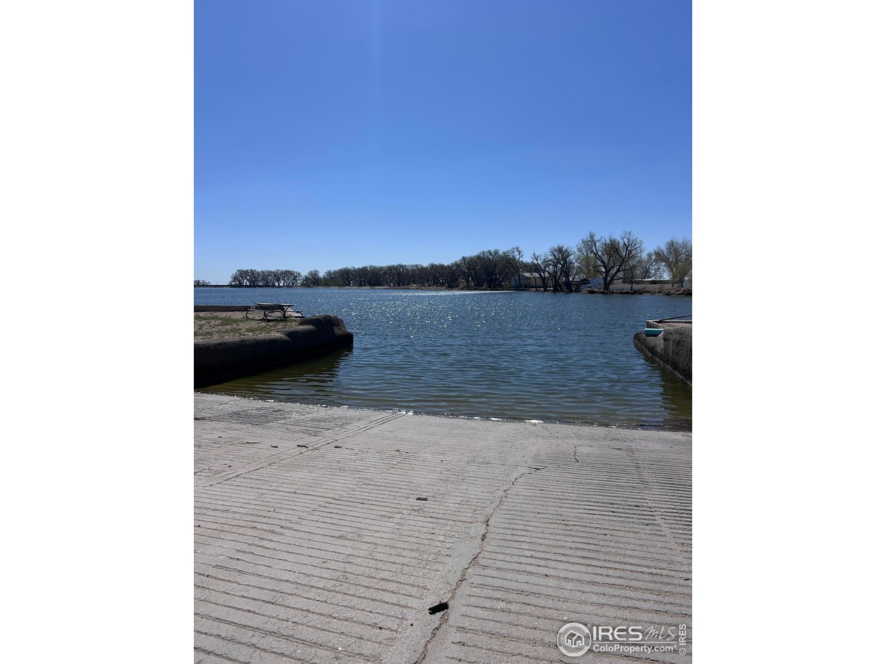 213 Kiowa Road Weldona, CO 80653 - Photo 23 of 25 a view of roof deck with lake view and mountain view