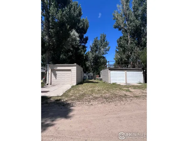 a backyard of a house with a yard and garage