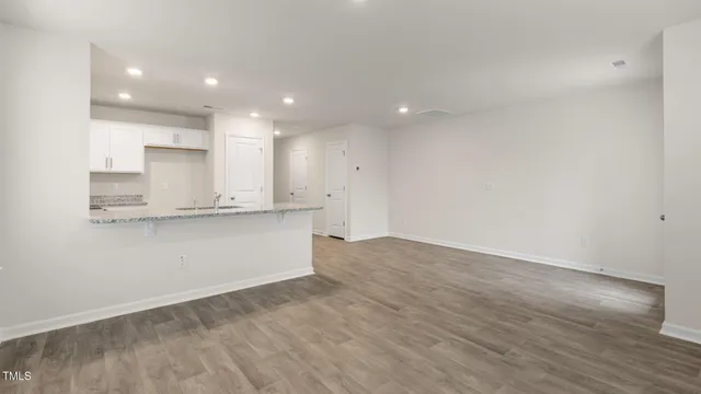 a view of kitchen with wooden floor
