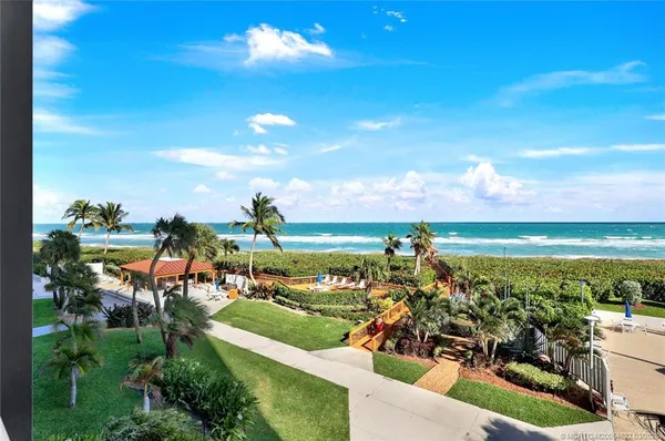 a view of a balcony with ocean view