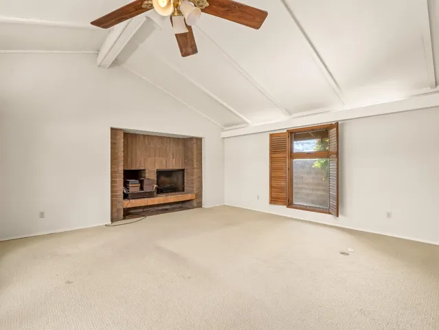 a view of an empty room with glass door
