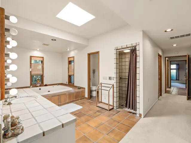 a bed room with a bed and a window