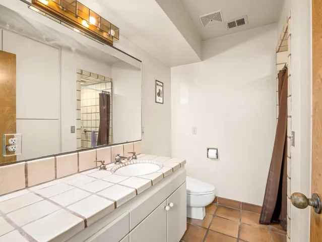 a kitchen with a refrigerator and a stove