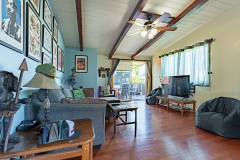 a kitchen that has a refrigerator and a stove