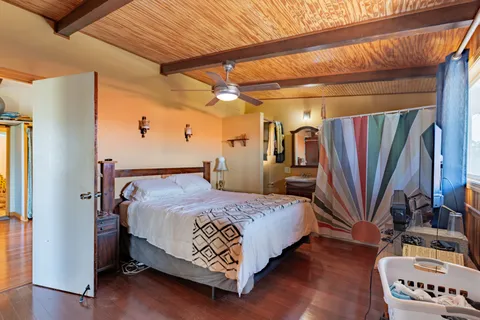 a bed room with a bed and a book shelf