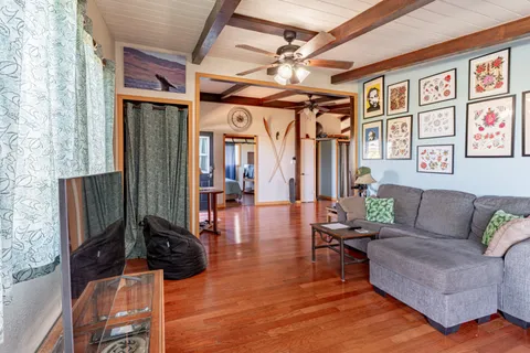a view of a dining room with furniture window and wooden floor