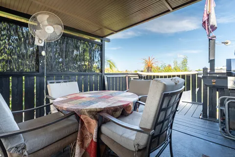 a view of an house with backyard porch and sitting area