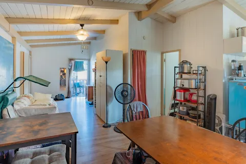 a kitchen with stainless steel appliances granite countertop a sink a stove and a refrigerator