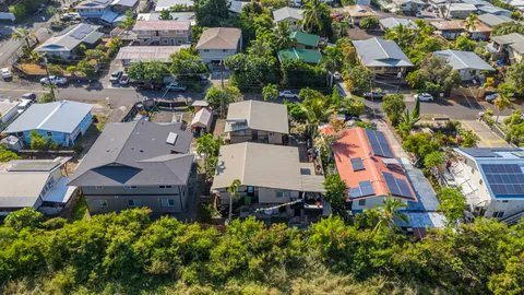 an aerial view of multiple houses with yard