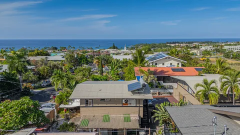 a view of a livingroom with furniture and hardwood floor