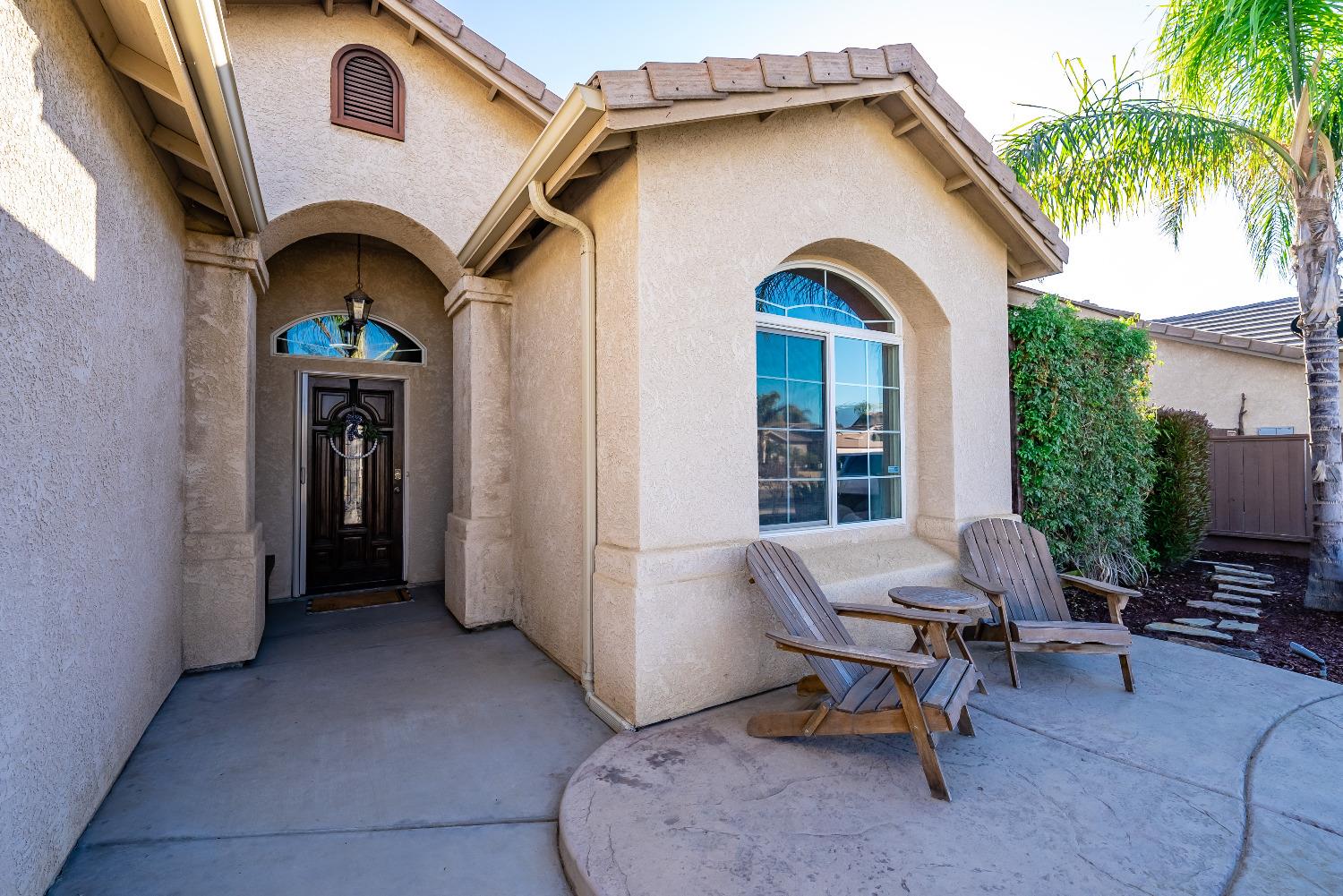 696 Crescent Lane Lemoore, CA 93245 - Photo 3 of 35 a view of swimming pool with outdoor seating and a potted plant