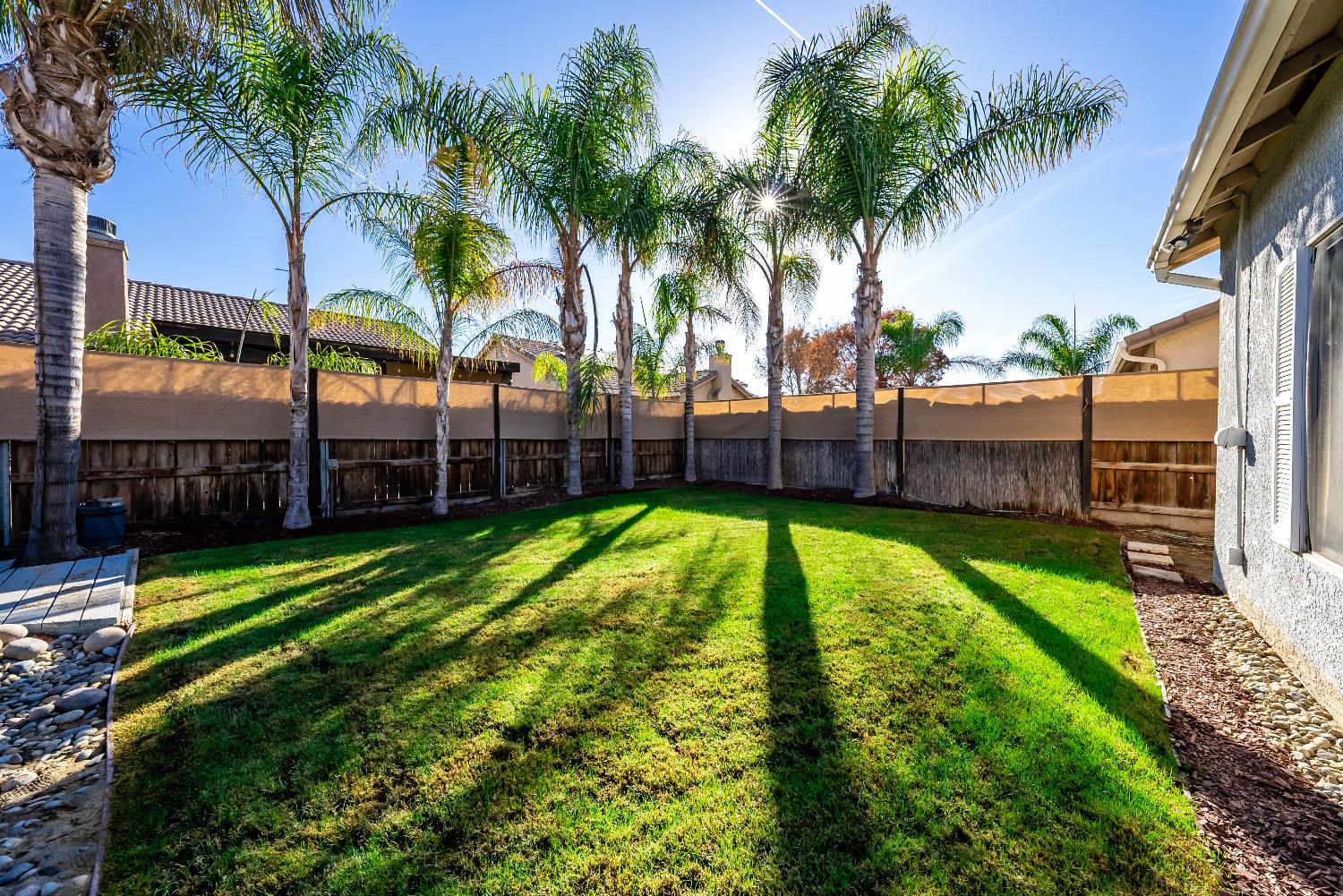 696 Crescent Lane Lemoore, CA 93245 - Photo 34 of 35 a view of a backyard with a garden and swimming pool