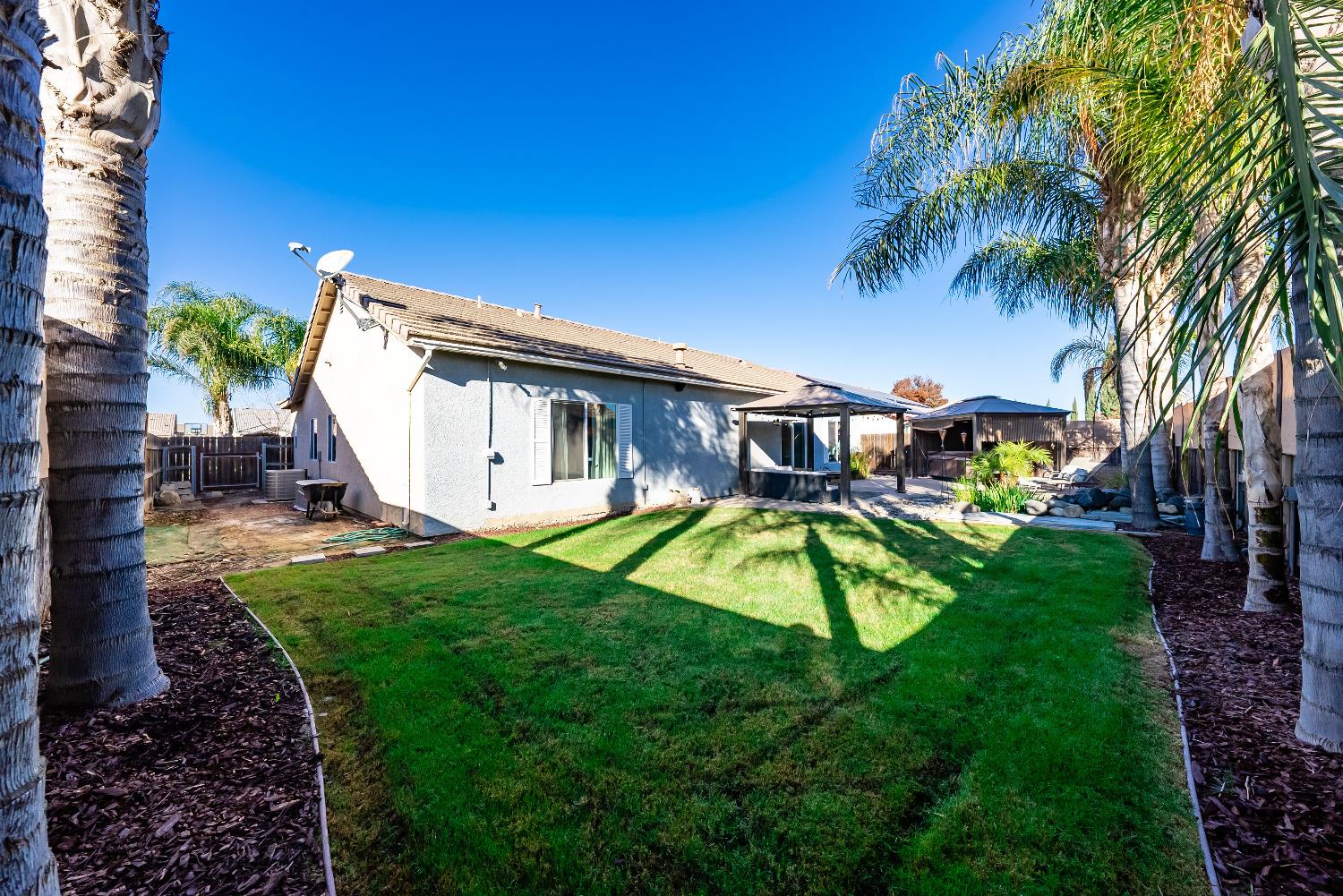 696 Crescent Lane Lemoore, CA 93245 - Photo 35 of 35 a view of a house with a backyard