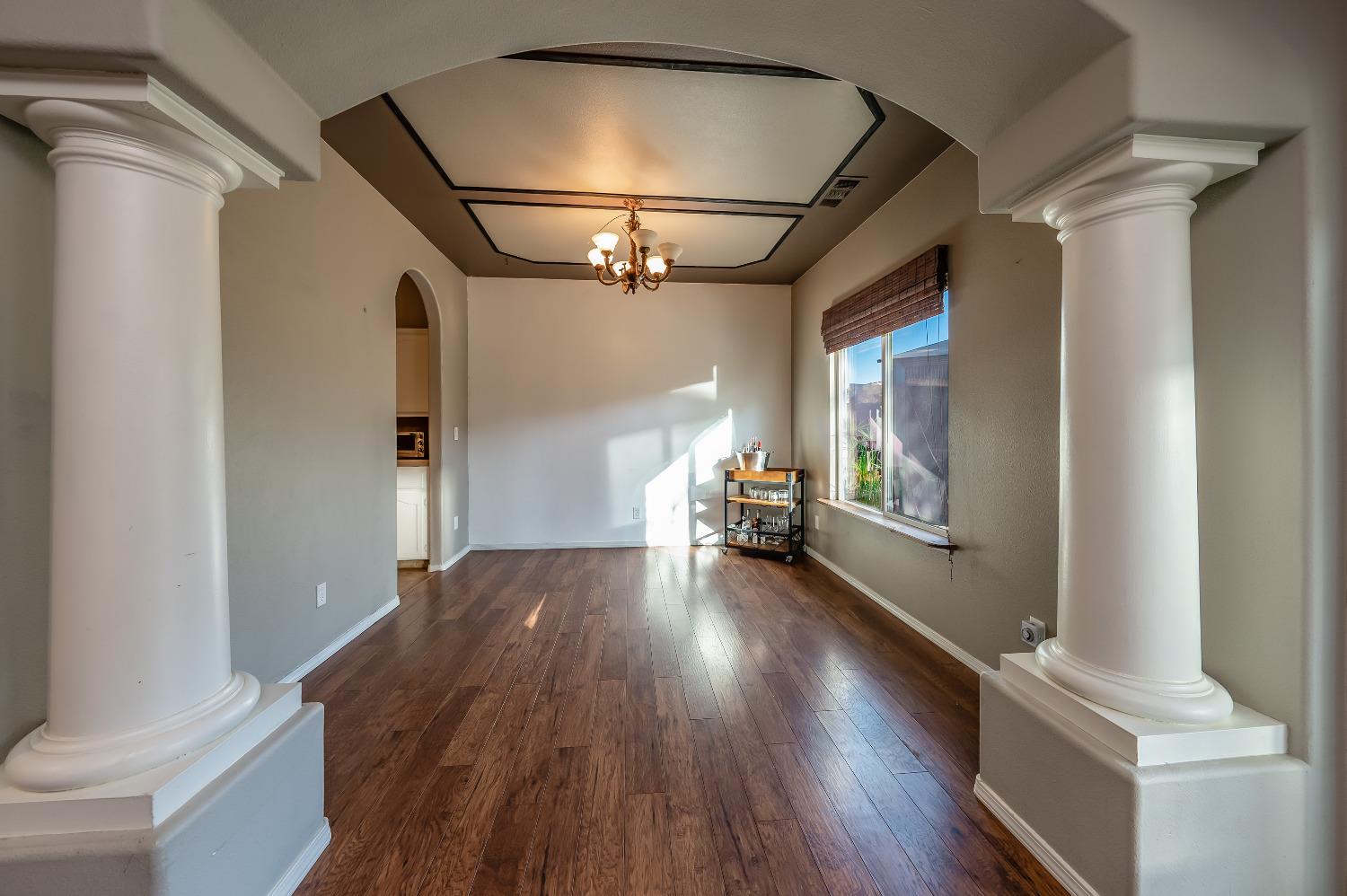 696 Crescent Lane Lemoore, CA 93245 - Photo 7 of 35 a view of empty room with wooden floor and fan