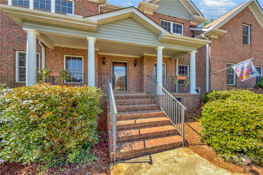 406 Hopewell Ridge Anderson, SC 29621 - Photo 2 of 46 This classic brick residence welcomes you with an inviting porch and a stately columned entrance.