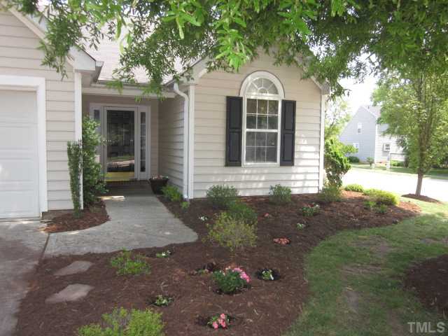 4553 Drewbridge Way Raleigh, NC 27604 - Photo 3 of 25 Lovely landscaped beds add great curb appeal to your new home! Wonderful covered front porch entry with storm door to welcome your guests!
