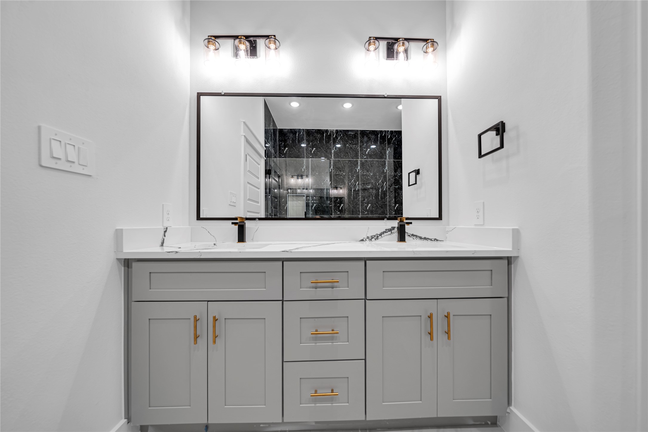 4902 Higgins Street, Unit B Houston, TX 77033 - Photo 13 of 24 a bathroom with double vanity sink and a mirror