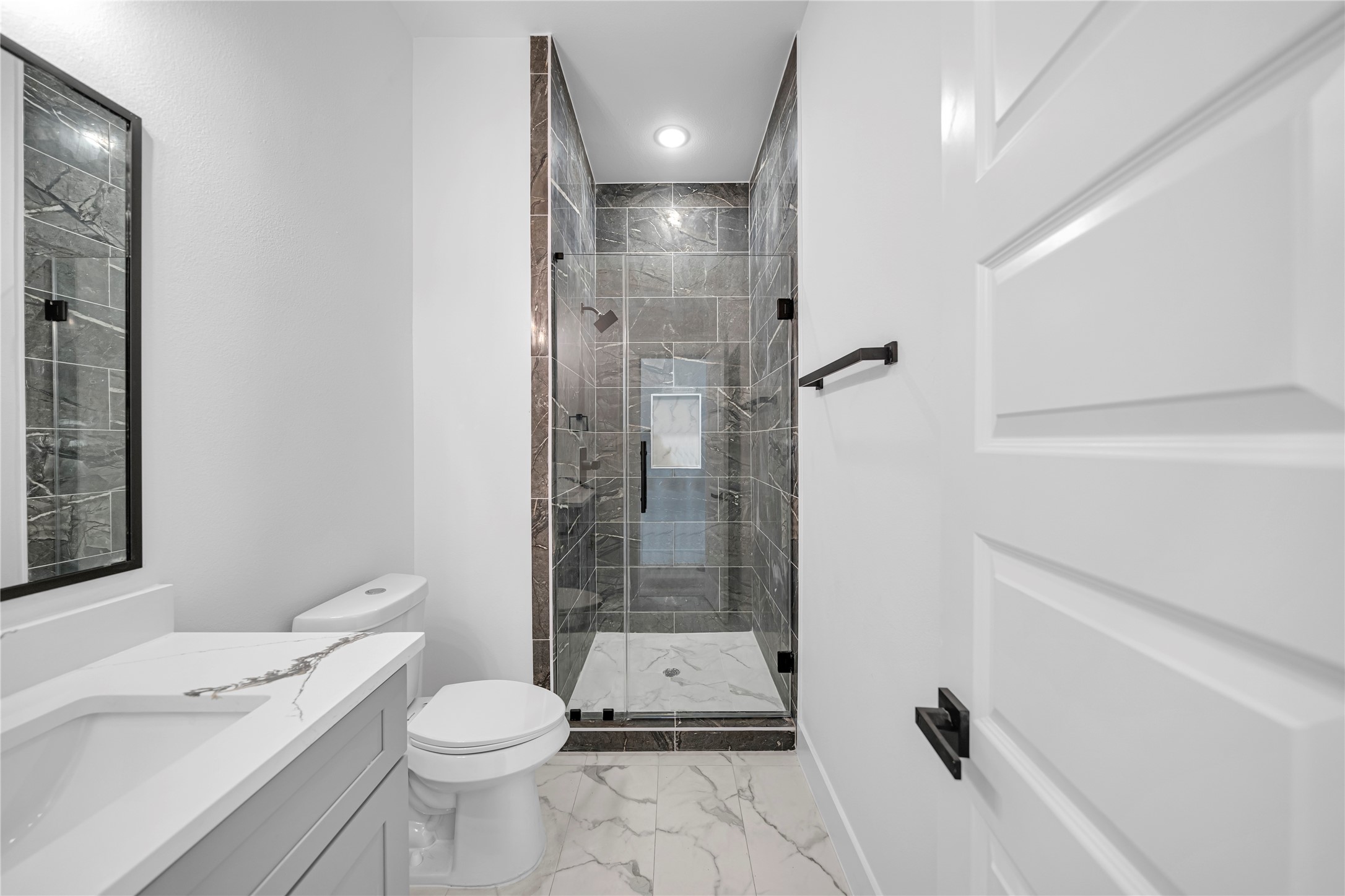 4902 Higgins Street, Unit B Houston, TX 77033 - Photo 24 of 24 a bathroom with a toilet a sink and shower