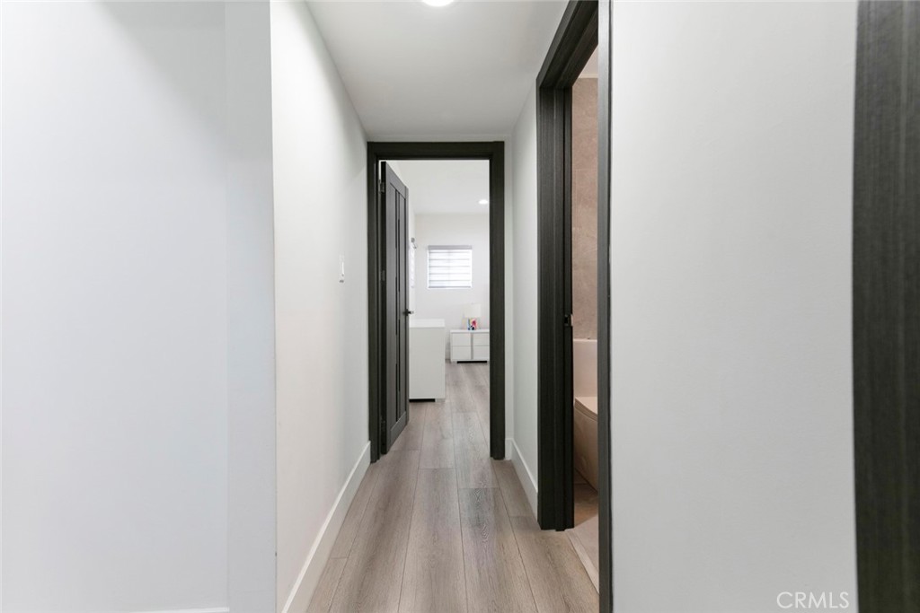 11836 Rialto Street Sun Valley, CA 91352 - Photo 14 of 23 a view of a hallway with wooden floor
