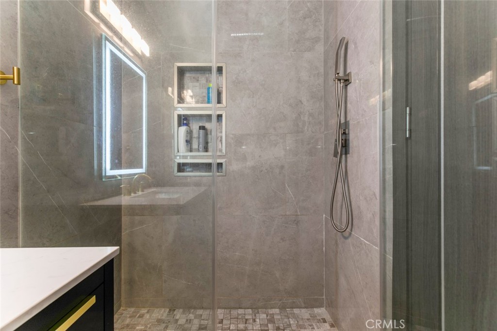 11836 Rialto Street Sun Valley, CA 91352 - Photo 16 of 23 a bathroom with a sink and shower