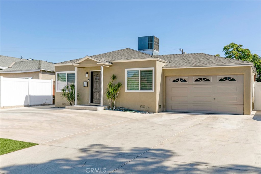 11836 Rialto Street Sun Valley, CA 91352 - Photo 2 of 23 a front view of a house with a garage