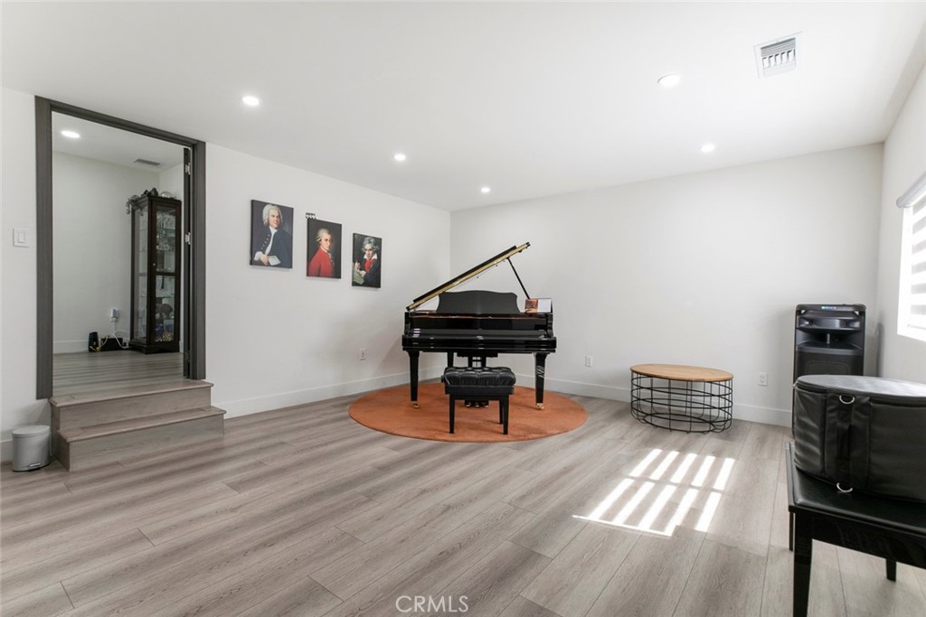 11836 Rialto Street Sun Valley, CA 91352 - Photo 6 of 23 a living room with furniture and a wooden floor