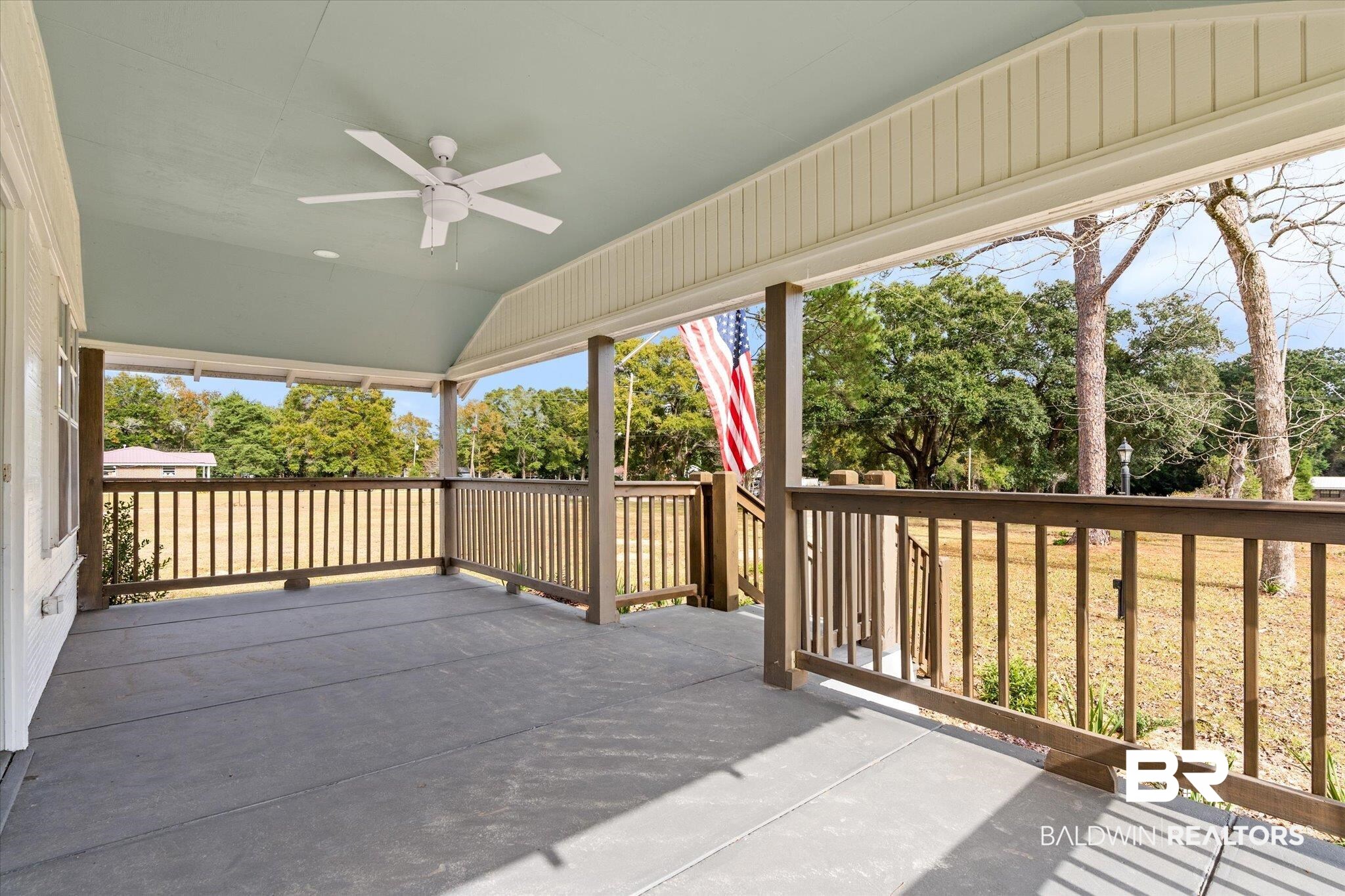 4630 General Road Mobile, AL 36619 - Photo 16 of 33 Wooden terrace with covered porch and ceiling fan