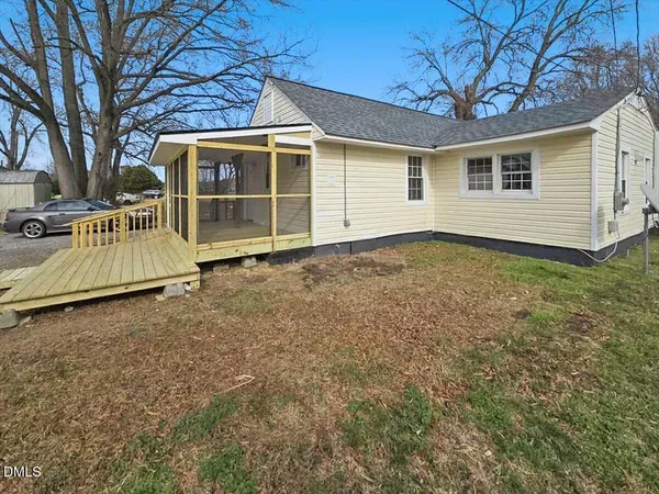 a view of a patio with a yard