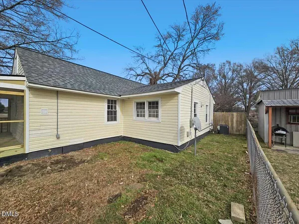 a view of a house with a yard and garage