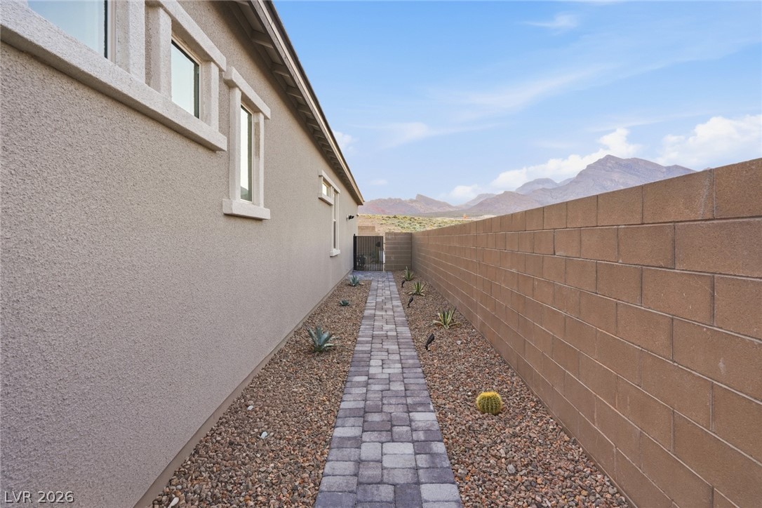 112 Springbough Lane Las Vegas, NV 89138 - Photo 41 of 41 Side yard with gate to front of home and driveway
