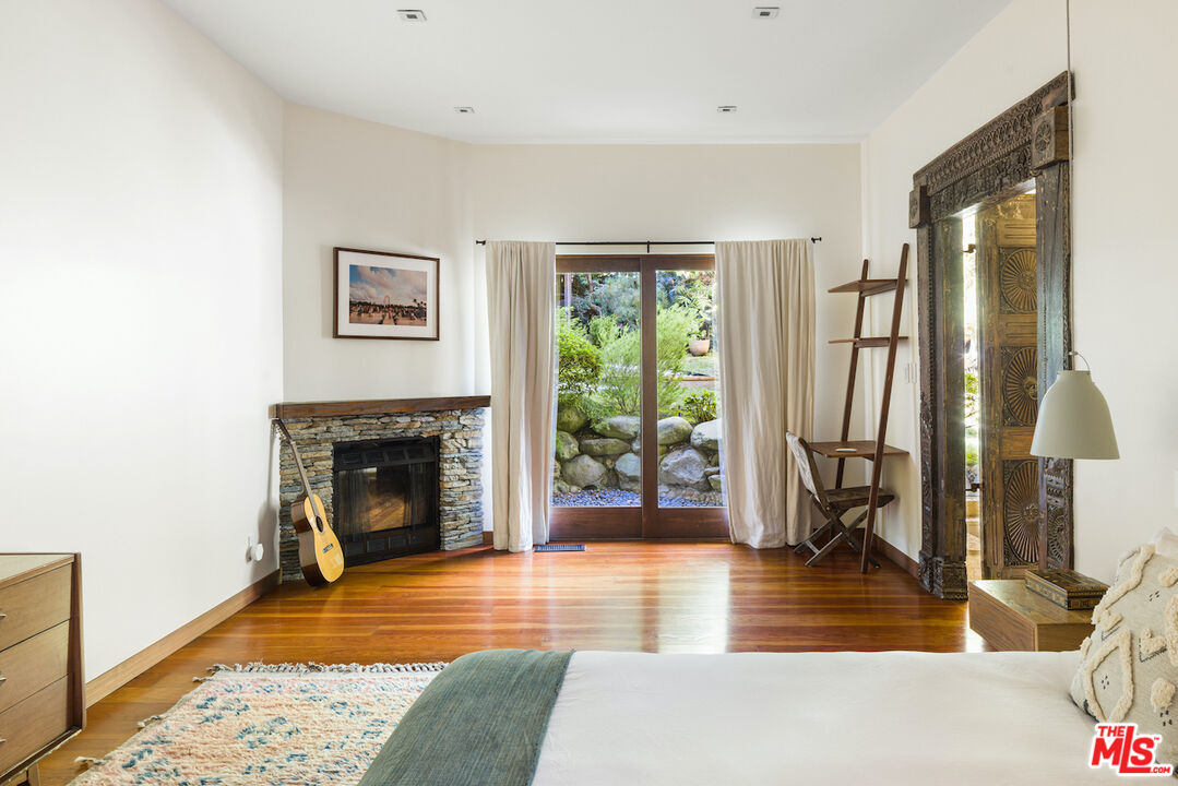 473 West Rustic Road Santa Monica, CA 90402 - Photo 17 of 34 a living room with furniture and a fireplace