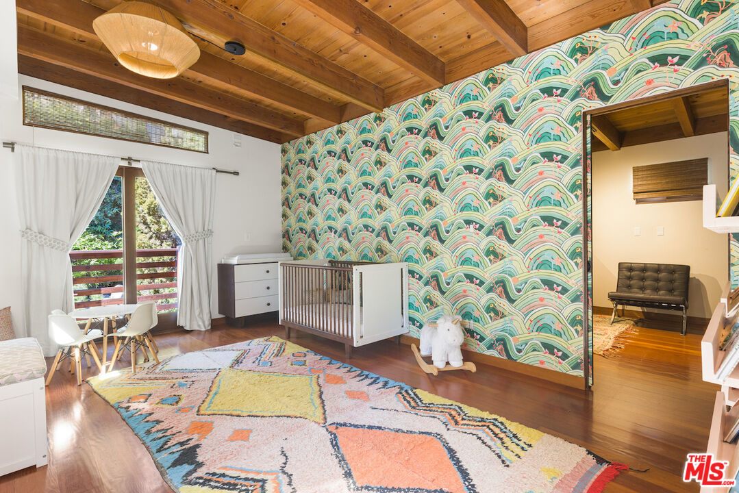 473 West Rustic Road Santa Monica, CA 90402 - Photo 26 of 34 a view of living room with a rug and a flat screen tv