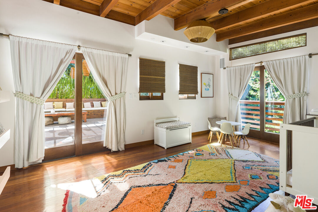 473 West Rustic Road Santa Monica, CA 90402 - Photo 28 of 34 a living room with furniture windows and wooden floor