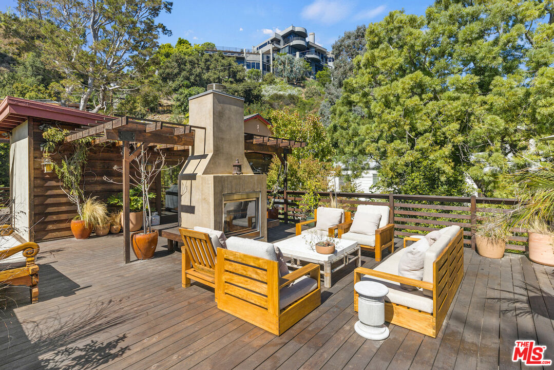 473 West Rustic Road Santa Monica, CA 90402 - Photo 33 of 34 a view of a roof deck with couches and wooden floor