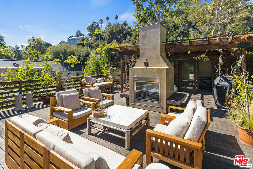 473 West Rustic Road Santa Monica, CA 90402 - Photo 34 of 34 a view of a patio with couches chairs and a fire pit