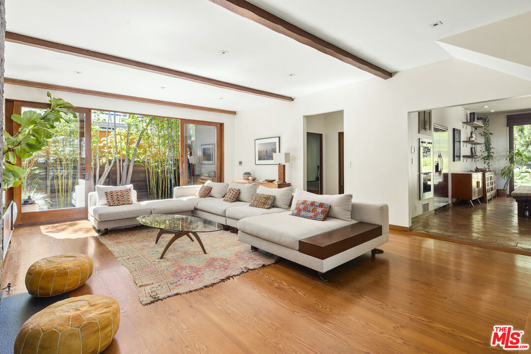 473 West Rustic Road Santa Monica, CA 90402 - Photo 4 of 34 a living room with furniture and a large window