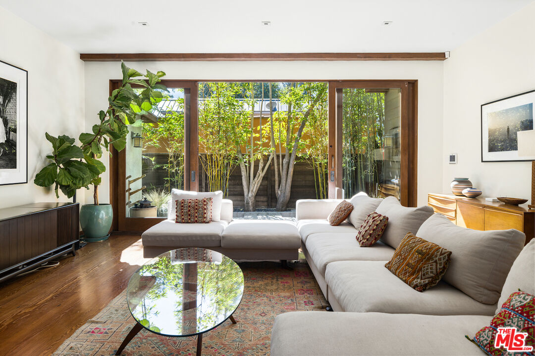 473 West Rustic Road Santa Monica, CA 90402 - Photo 5 of 34 a living room with furniture and a large window