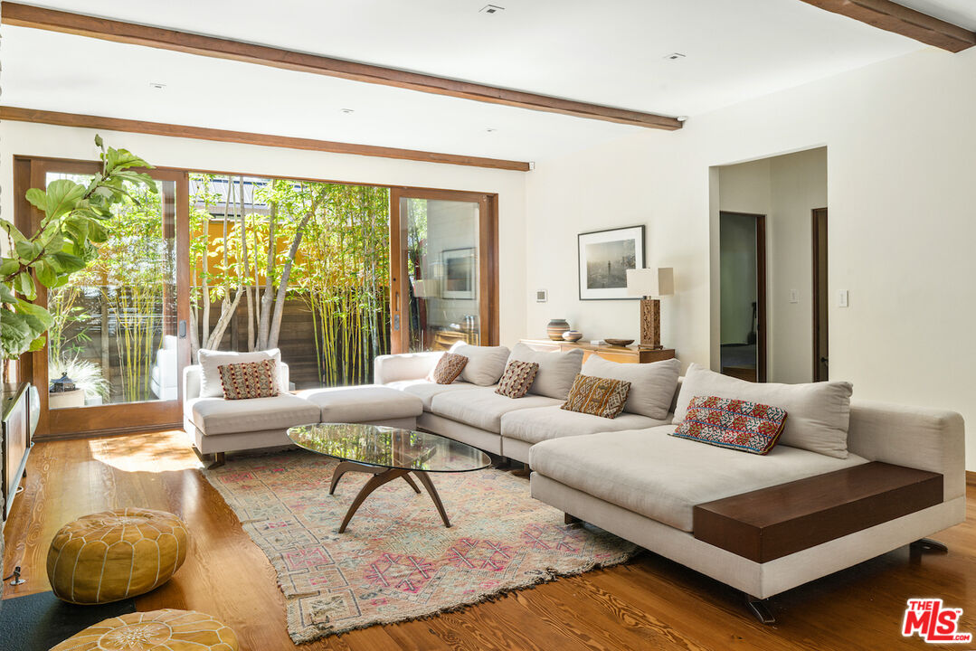 473 West Rustic Road Santa Monica, CA 90402 - Photo 6 of 34 a living room with furniture and a large window
