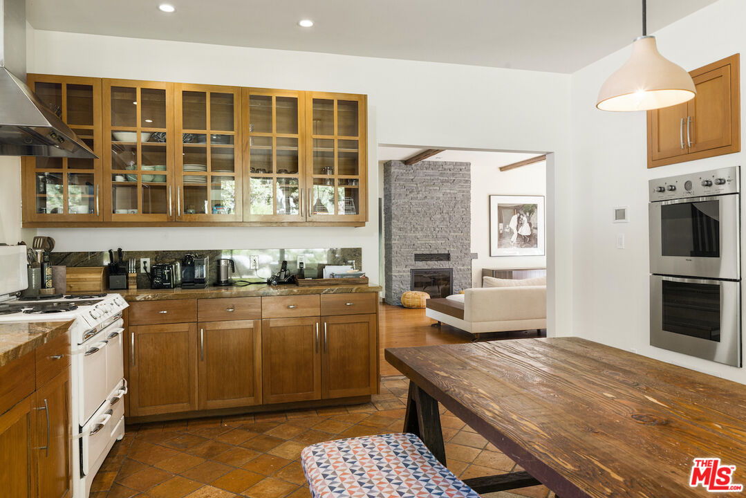 473 West Rustic Road Santa Monica, CA 90402 - Photo 7 of 34 a kitchen with a stove a sink and a refrigerator