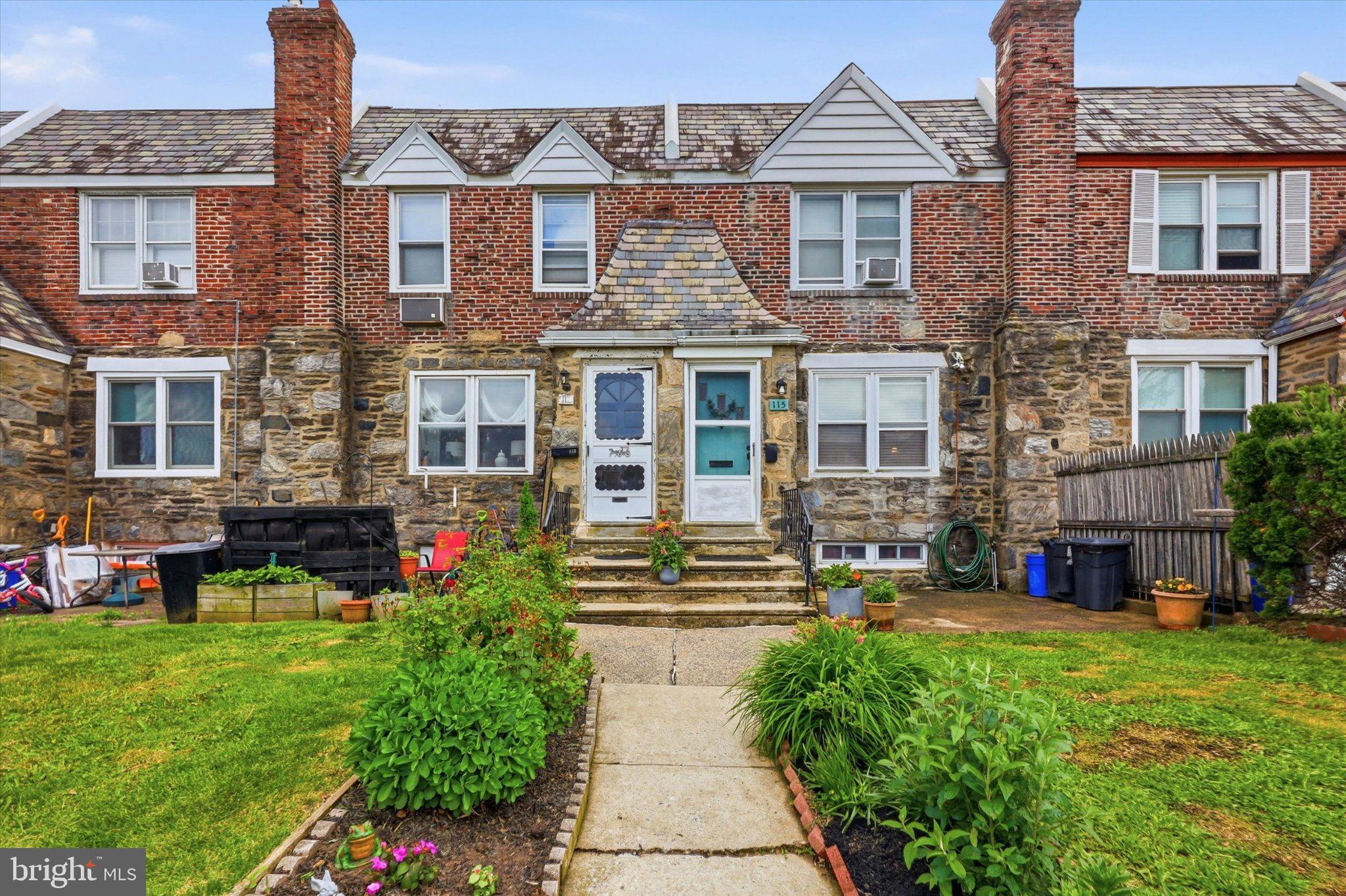 115 Academy Lane Upper Darby, PA 19082 - Photo 1 of 25 a front view of a house with garden