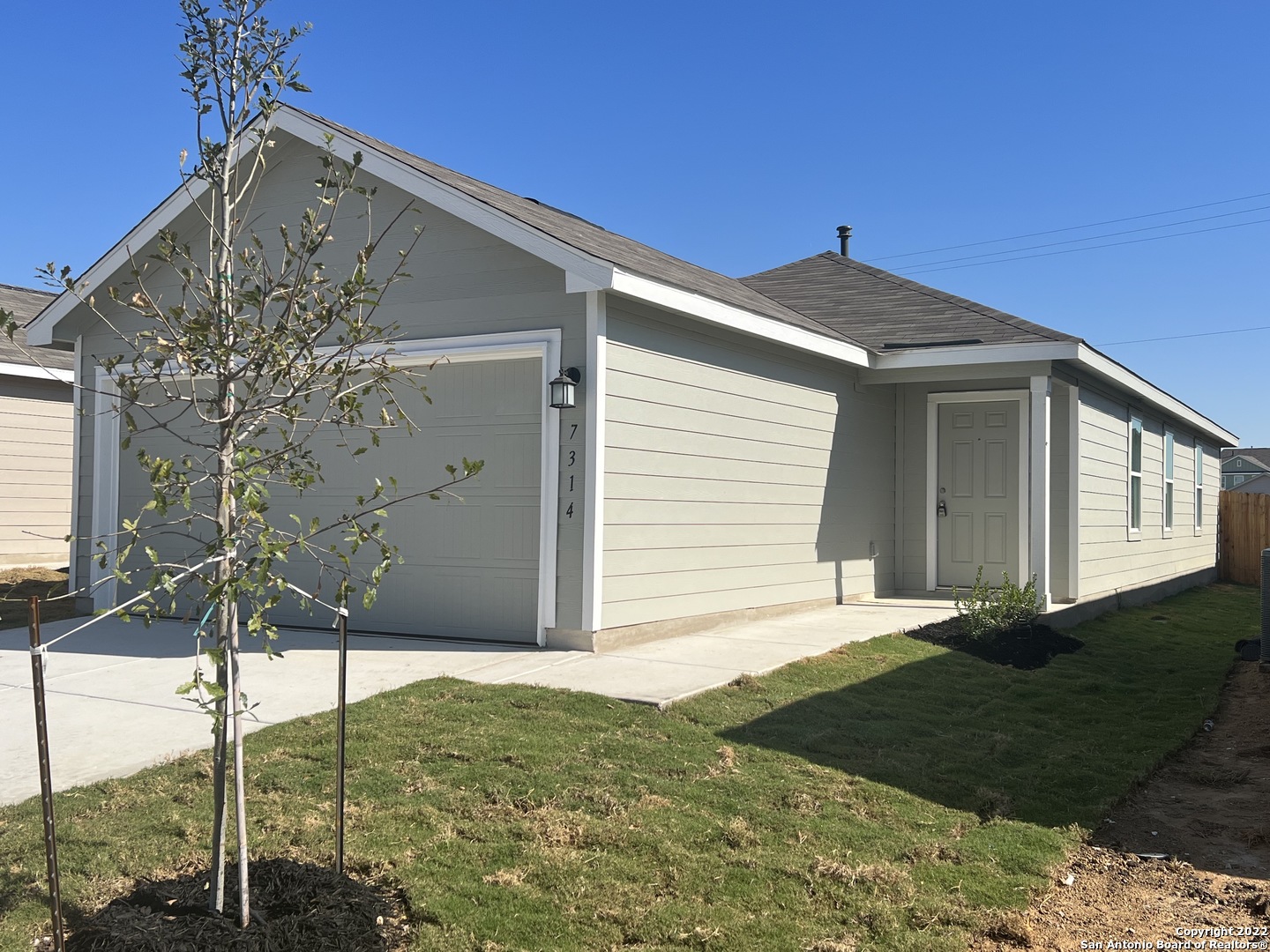 7314 Silos Ridge San Antonio, TX 78252 - Photo 2 of 45 a front view of a house with a yard
