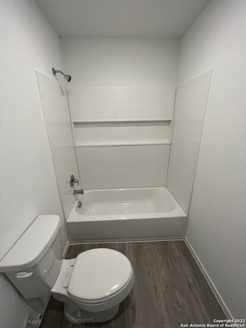 7314 Silos Ridge San Antonio, TX 78252 - Photo 21 of 45 a bathroom with a toilet and a bathtub