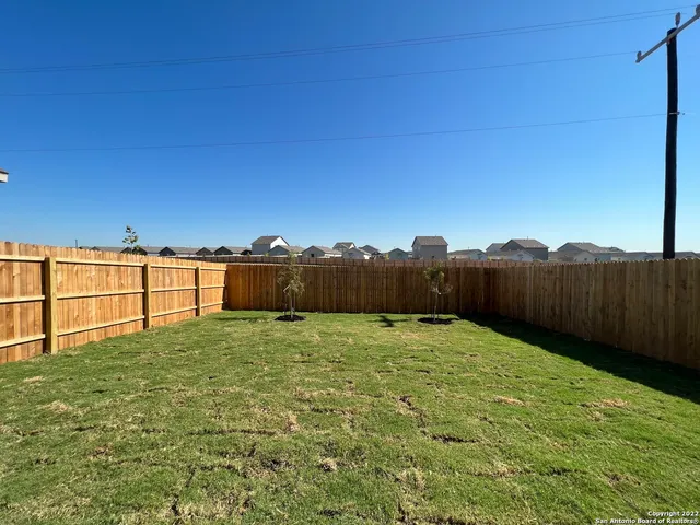 a view of a hall with floor to ceiling windows