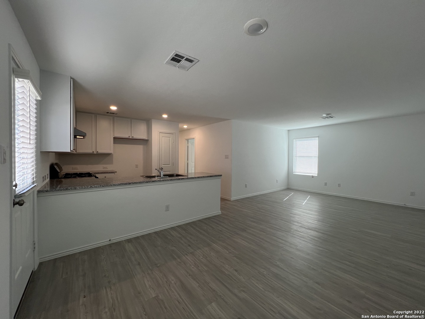 7314 Silos Ridge San Antonio, TX 78252 - Photo 6 of 45 a large kitchen with stainless steel appliances granite countertop a large counter top a sink and a dishwasher