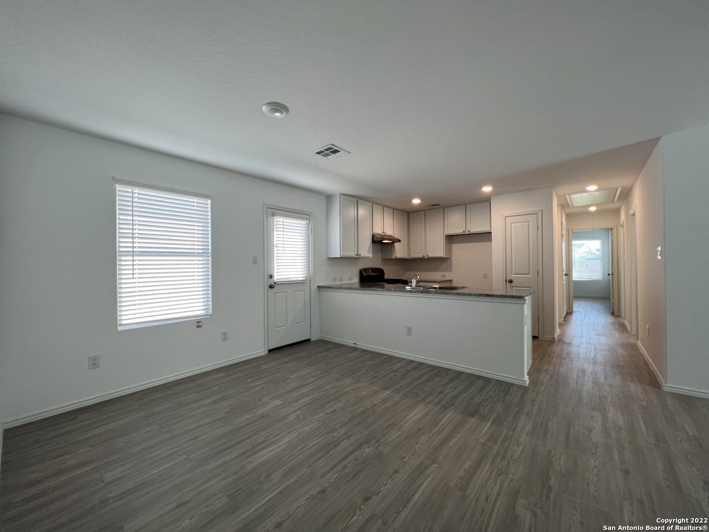 7314 Silos Ridge San Antonio, TX 78252 - Photo 7 of 45 a view of kitchen with wooden floor and electronic appliances