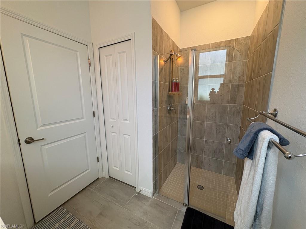 2458 Orchard Street Naples, FL 34120 - Photo 31 of 43 a bathroom with a shower