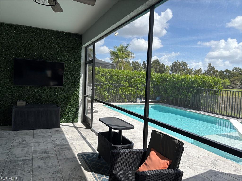 2458 Orchard Street Naples, FL 34120 - Photo 41 of 43 a balcony with chairs