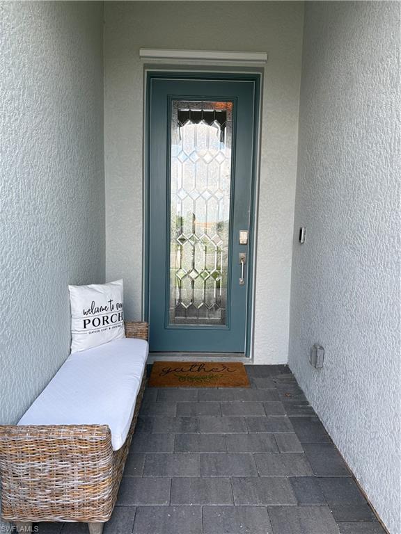 2458 Orchard Street Naples, FL 34120 - Photo 6 of 43 a bedroom with a bed and window