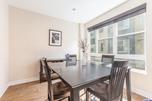a view of a dining room with furniture and window