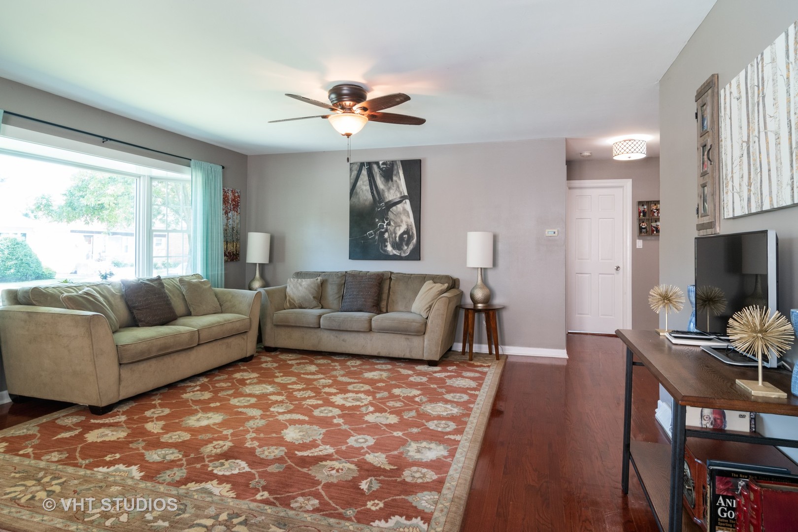 137 East Quincy Street Riverside, IL 60546 - Photo 4 of 14 a living room with furniture and a flat screen tv